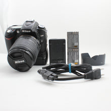 * USED * Nikon D90 with AF-S Nikkor DX 18-105mm f/3.5-5.6G ED VR and MB-D80 Battery Pack SHUTTER 4180